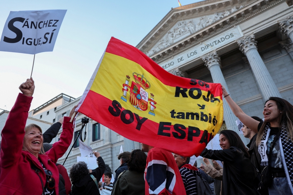 People march to show support for Spain's Prime Minister Pedro Sanchez, in Madrid. — Reuters 