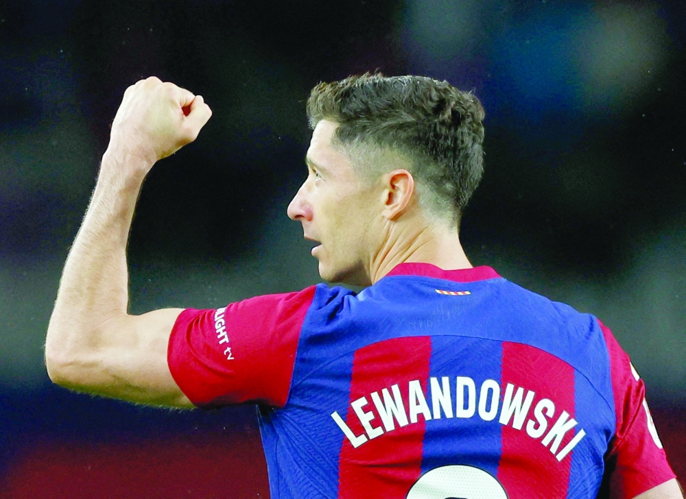 Barcelona's Robert Lewandowski celebrates scoring their third goal. -  REUTERS