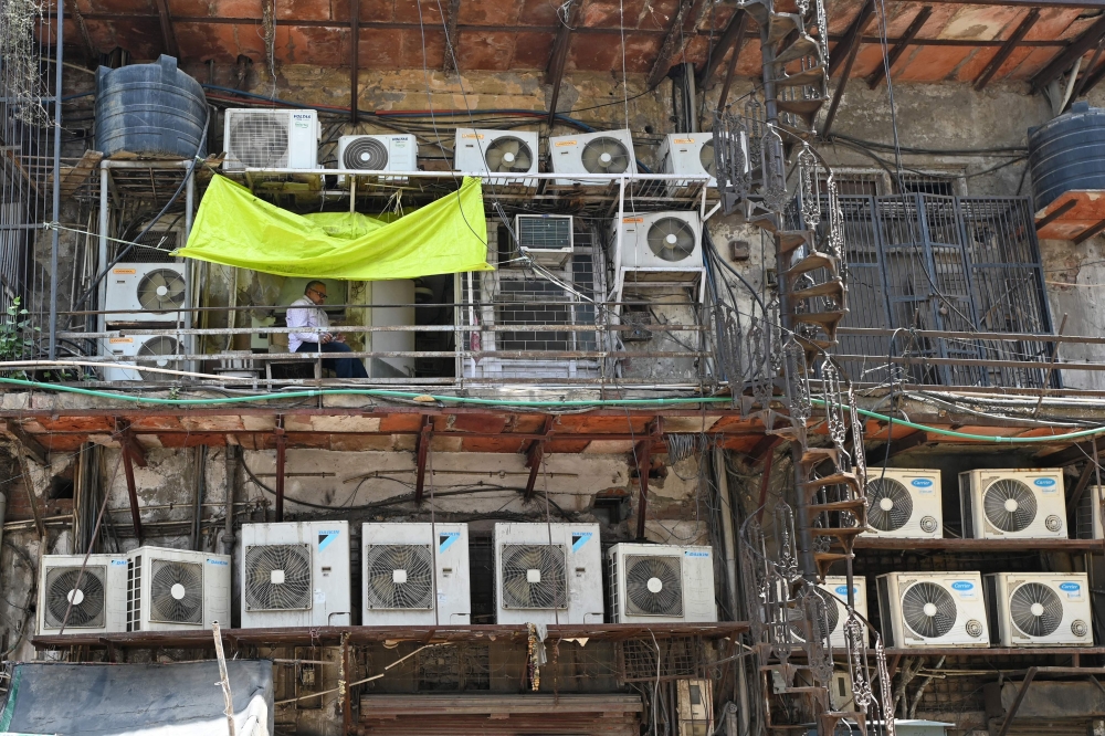 Air conditioning units installed on the facade of a building in New Delhi