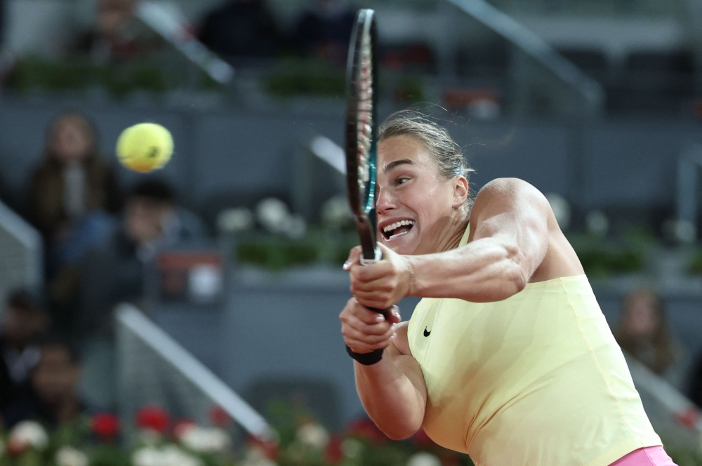 Belarus' Aryna Sabalenka reacts to winning a point against Kazakhstan's Elena Rybakina during the 2024 WTA Tour Madrid Open tournament semifinal tennis match 