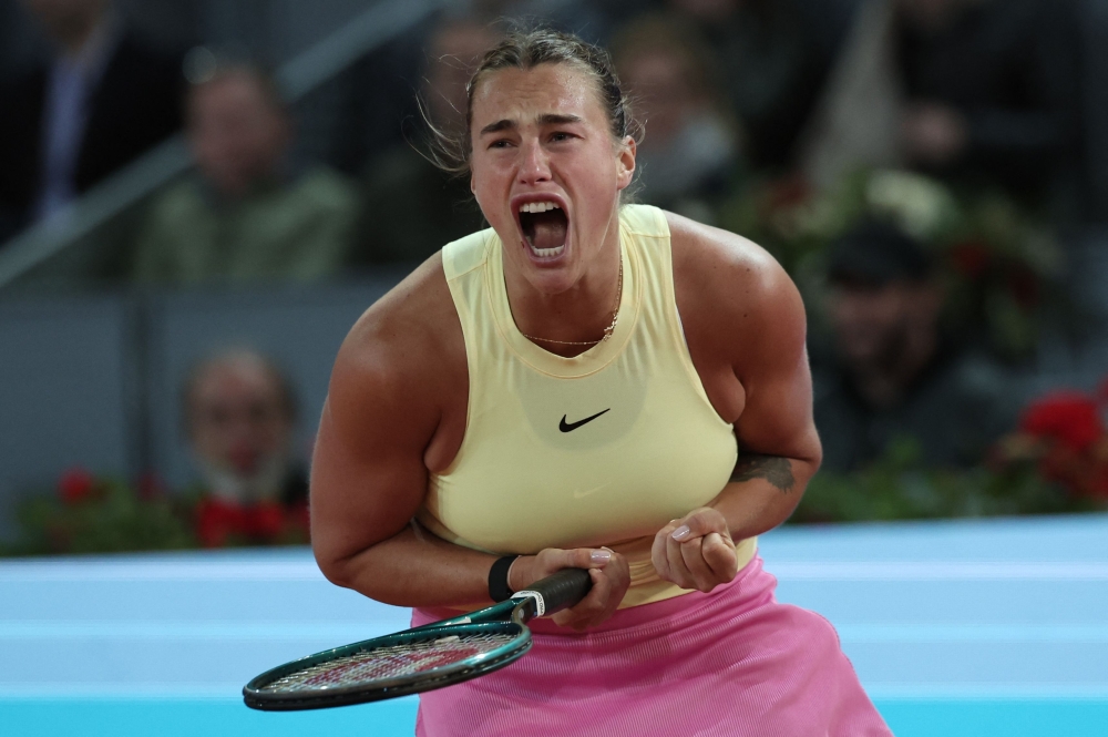Belarus' Aryna Sabalenka reacts to winning a point against Kazakhstan's Elena Rybakina during the 2024 WTA Tour Madrid Open tournament semifinal tennis match 
