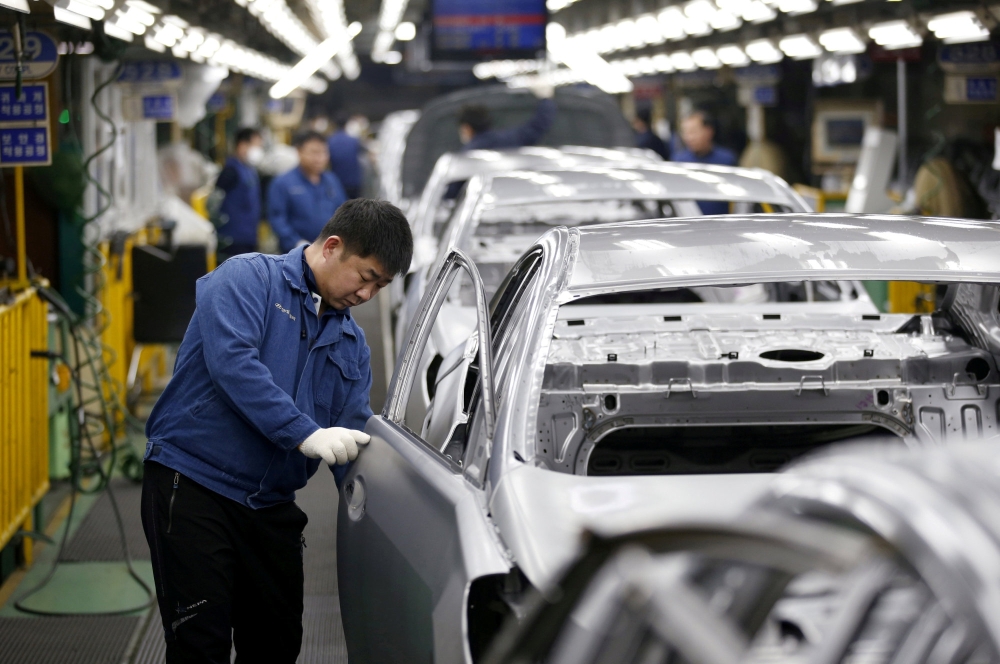 An employee works at an assembly line of Hyundai Motor's plant in Asan, South Korea. — Reuters