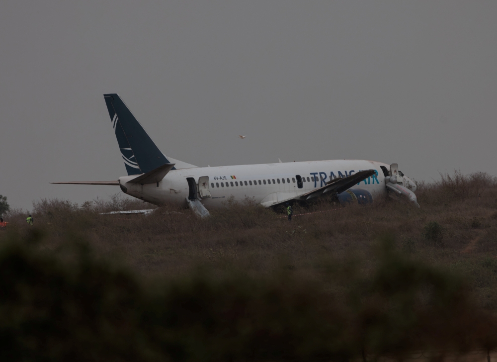 A plane is seen after skidding off the runway at Blaise Diagne International Airport in Dakar on Thursday. — Reuters