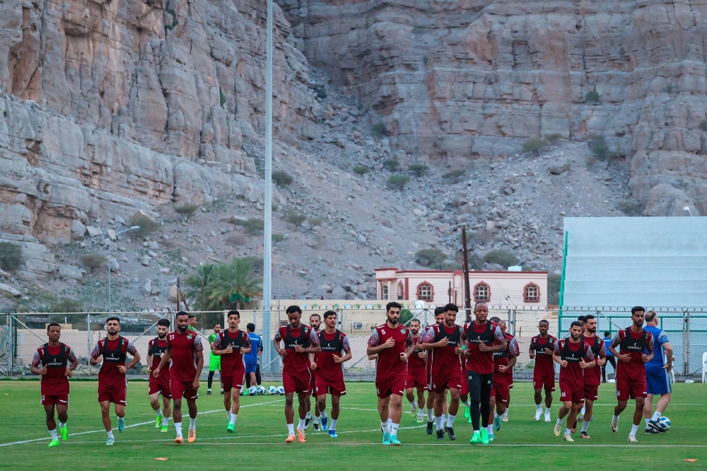 Al Nahdha players attend a training session.