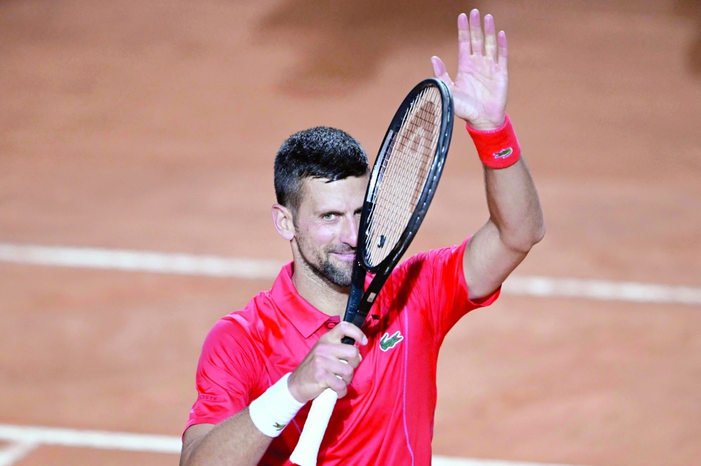 Novak Djokovic celebrates after winning against France's Corentin Moutet  during the Men's ATP Rome Open tennis tournament at Foro Italico in Rome.