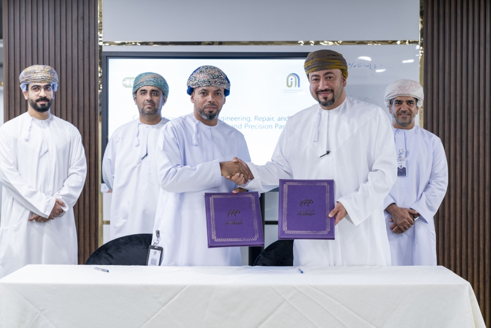Eng Majid al Hinai of Intaj Suhar signing the agreements with representatives of local manufacturing units.