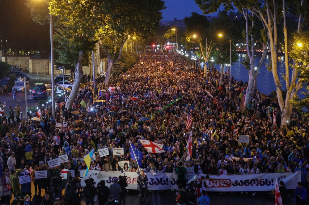 Protesters march during a rally against the controversial "foreign influence" bill in Tbilisi on May 11. — AFP 