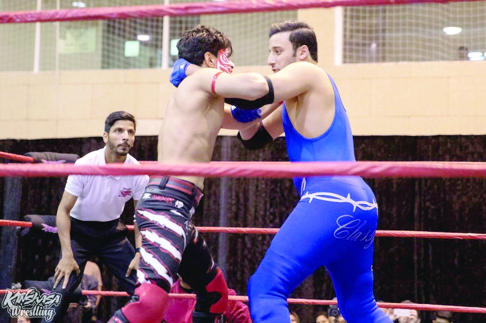 Anas al Riyami (left) during an event in Qatar.