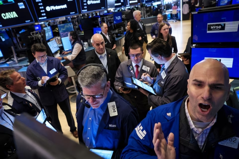 Traders work on the floor at the New York Stock Exchange in New York City, US. — Reuters