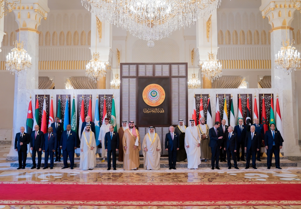 Heads and representatives of Arab countries attending the 33rd Arab Summit pose for a family photo in Sakhir Palace, Bahrain, on Thursday. 