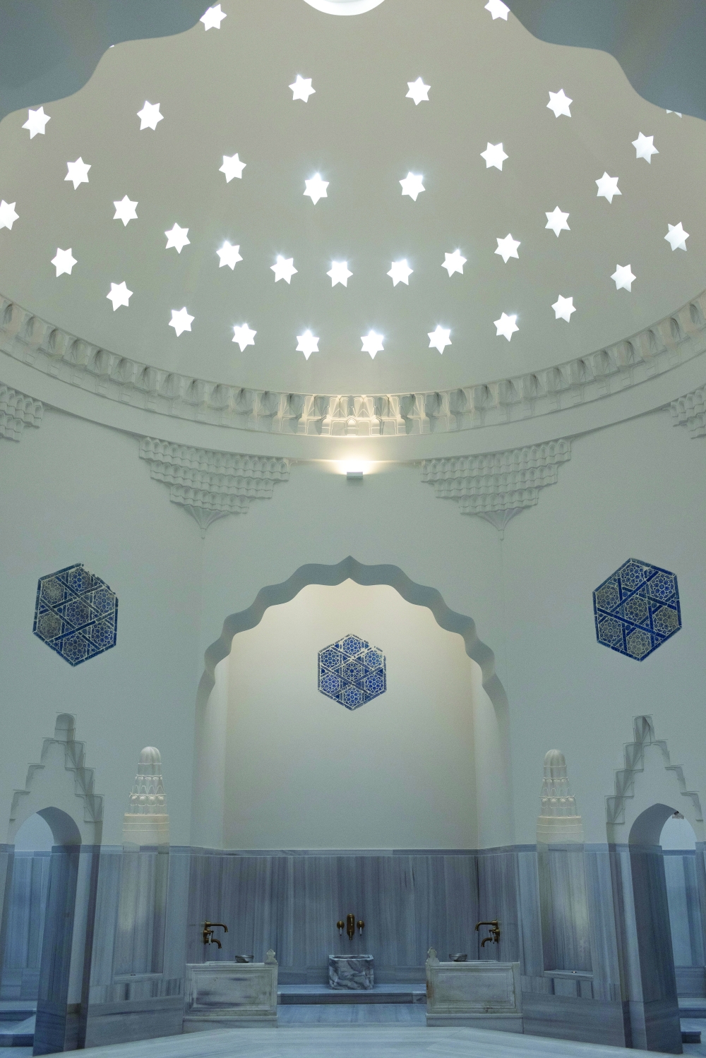 A steam room at the Zeyrek Cinili Hamam in Istanbul, where visitors can enjoy a Turkish bath under domes pierced with star-shaped skylights, on April 24, 2024. (Bradley Secker/The New York Times)