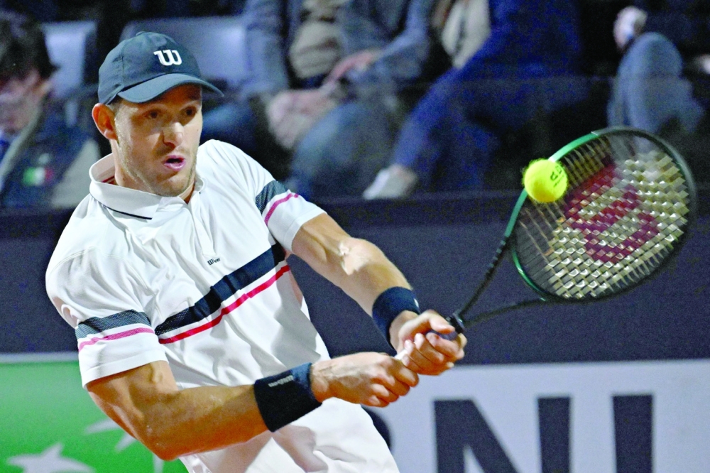 Nicolas Jarry hits a return to Paul.— AFP

