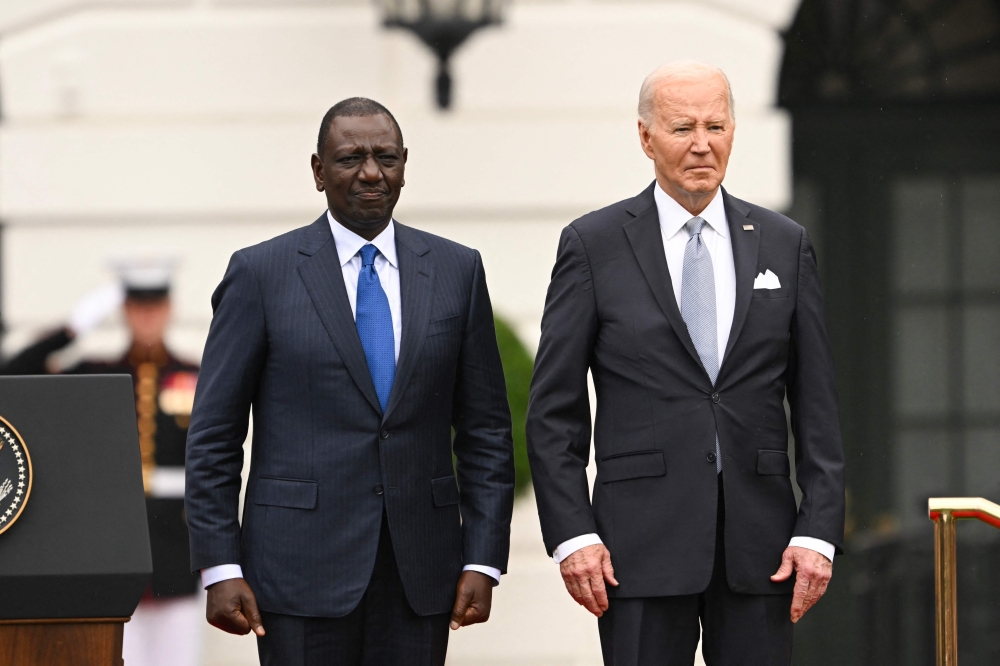 US President Joe Biden (R) and President William Ruto stand together during an official arrival ceremony on the South Lawn of the White House in Washington, DC, on May 23, 2024. Ruto's visit is the first state visit to Washington by an African leader in more than 15 years. 
 (Photo by ROBERTO SCHMIDT / AFP)

