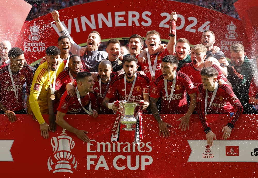 Manchester United's Bruno Fernandes celebrates with the trophy.— Reuters
