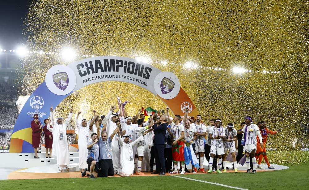 Soccer Football - Asian Champions League - Final - Second Leg - Al Ain v Yokohama F Marinos - Hazza bin Zayed Stadium, Abu Dhabi, United Arab Emirates - May 25, 2024 Al Ain players celebrate after winning the AFC Champions League final REUTERS/Rula Rouhana
