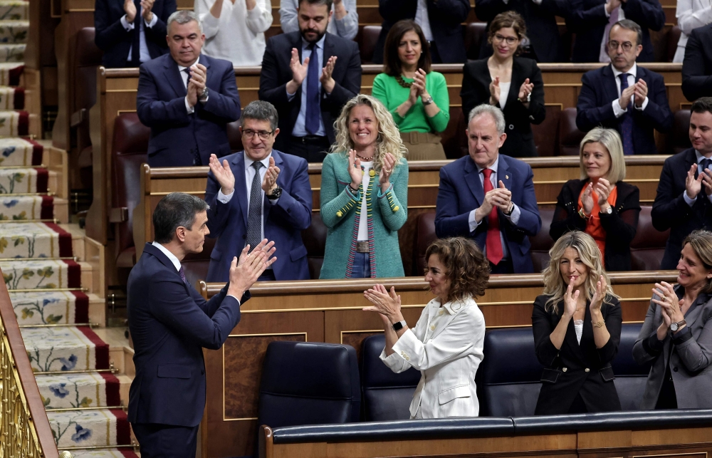 Spain's Prime Minister Pedro Sanchez is applauded after delivering a speech to announce that Spain will recognise Palestine as a state on May 28, 