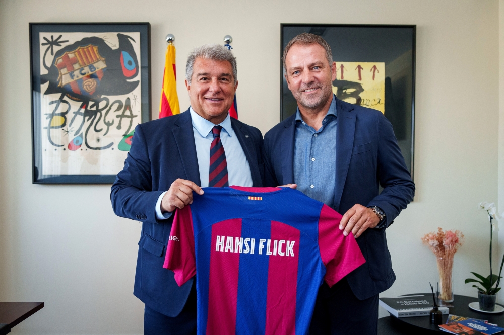  FC Barcelona's president Joan Laporta poses with newly signed coach Hansi Flick.— REUTERS