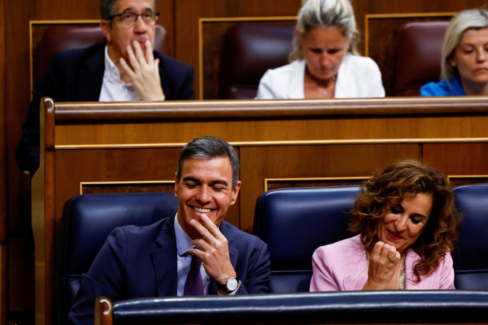 Spanish Prime Minister Pedro Sanchez and First Deputy Prime Minister Maria Jesus Montero at the parliament in Madrid on Thursday. — Reuters