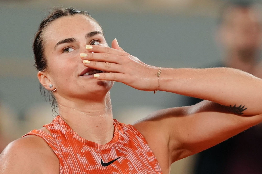 TOPSHOT - Belarus' Aryna Sabalenka celebrates after winning against Japan's Moyuka Uchijima at the end of their women's singles match on Court Philippe-Chatrier on day five of the French Open tennis tournament at the Roland Garros Complex in Paris on May 30, 2024.  (Photo by Dimitar DILKOFF / AFP)

