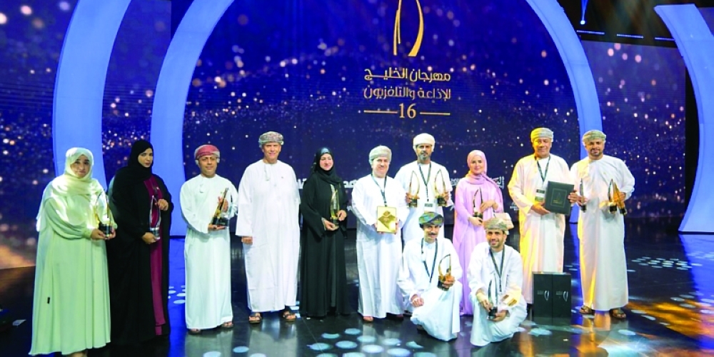 Omani winners with their trophies 