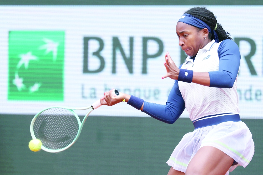 US Coco Gauff plays a forehand return to Ukraine's Dayana Yastremska during their women's singles match on Court Philippe-Chatrier on day six of the French Open tennis tournament at the Roland Garros Complex in Paris on May 31, 2024. 