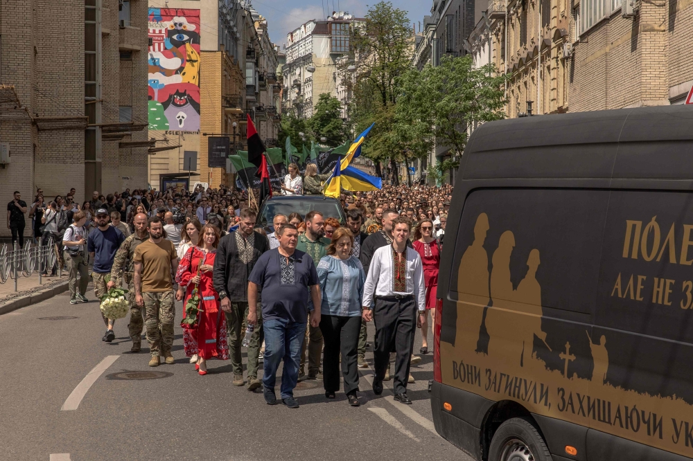 Mourners attend the funeral ceremony of Iryna "Cheka" Tsybukh, who was killed in action in the Kharkiv region, in Kyiv. — AFP 