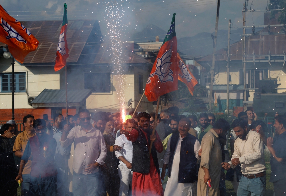 Supporters of Bharatiya Janata Party (BJP) light fireworks to celebrate on the day of the general election results, in Srinagar. — Reuters 