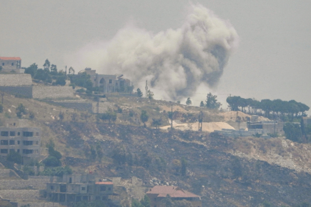 Smoke billows during Israeli bombardment on the southern Lebanese border village of Khiam. — AFP 