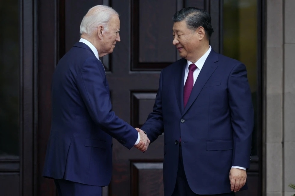 President Joe Biden greets China’s President President Xi Jinping in Woodside, US.  

