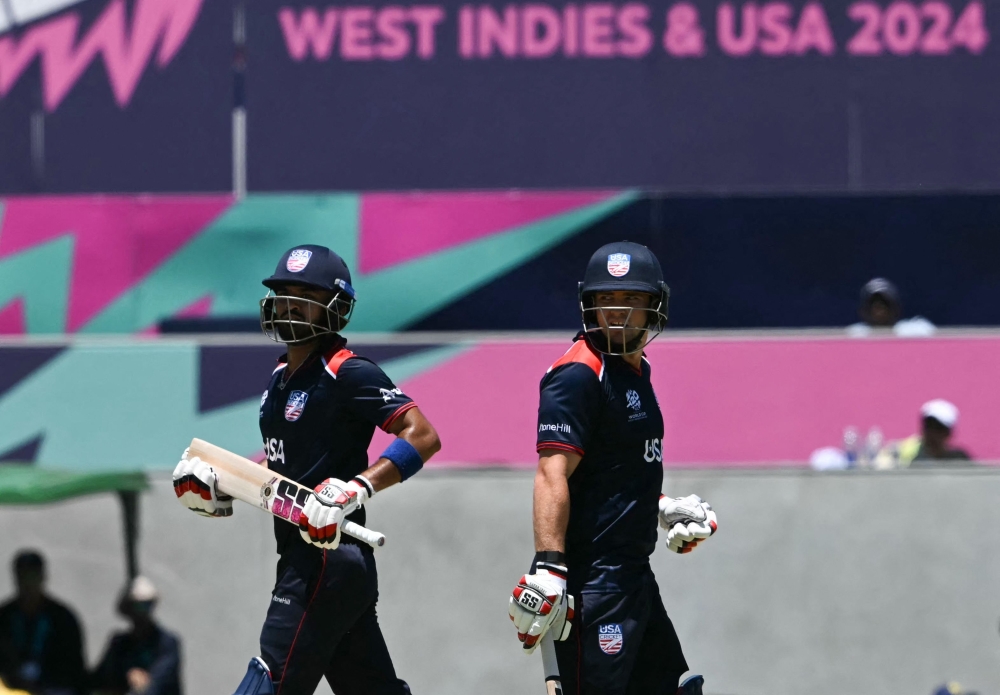 USA's Andries Gous (R) and captain Monank Patel celebrate scoring 51 runs during the ICC men's Twenty20 World Cup 2024 group A cricket match between the USA and Pakistan at the Grand Prairie Cricket Stadium in Grand Prairie