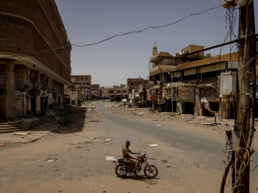 A Sudanese Armed Forces soldier drove through the ruins of the historic Al-Shaabi market in Omdurman, Sudan, outside Khartoum, on April 22, 2024. (Ivor Prickett/The New York Times)