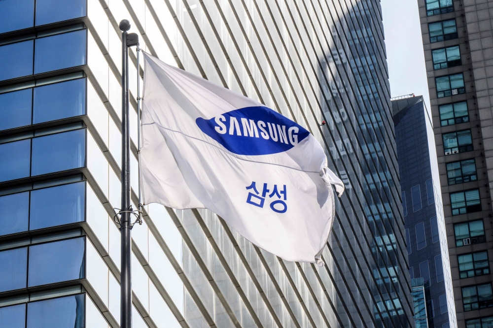 The Samsung flag flutters in the wind outside the company building in Seoul