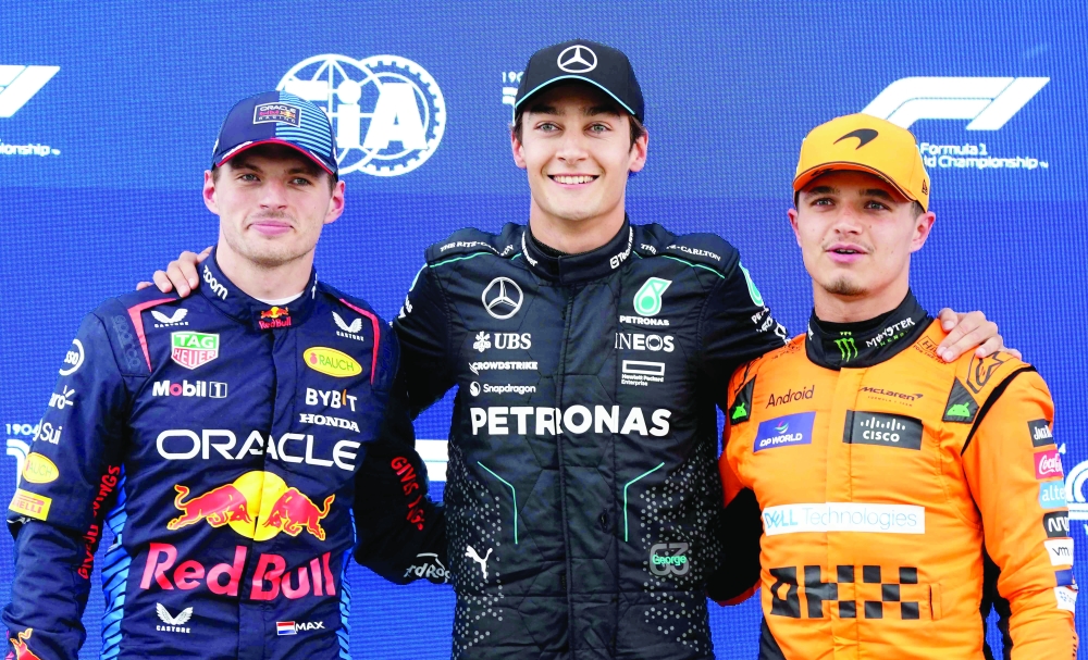 (L-R) Second place Max Verstappen; pole winner George Russell; and third place Lando Norris.— AFP

