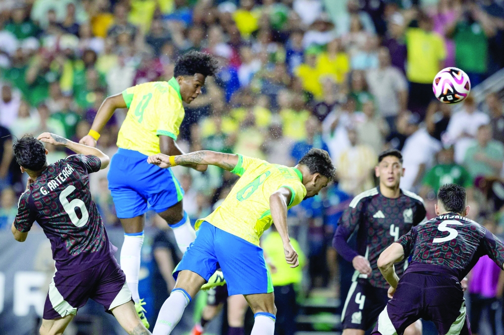 Brazil's forward #09 Endrick (2nd L) scores his team's third goal during the international friendly football match between Brazil and Mexico at Kyle Field in College Station, Texas, on June 8, 2024. (Photo by Aric Becker / AFP)