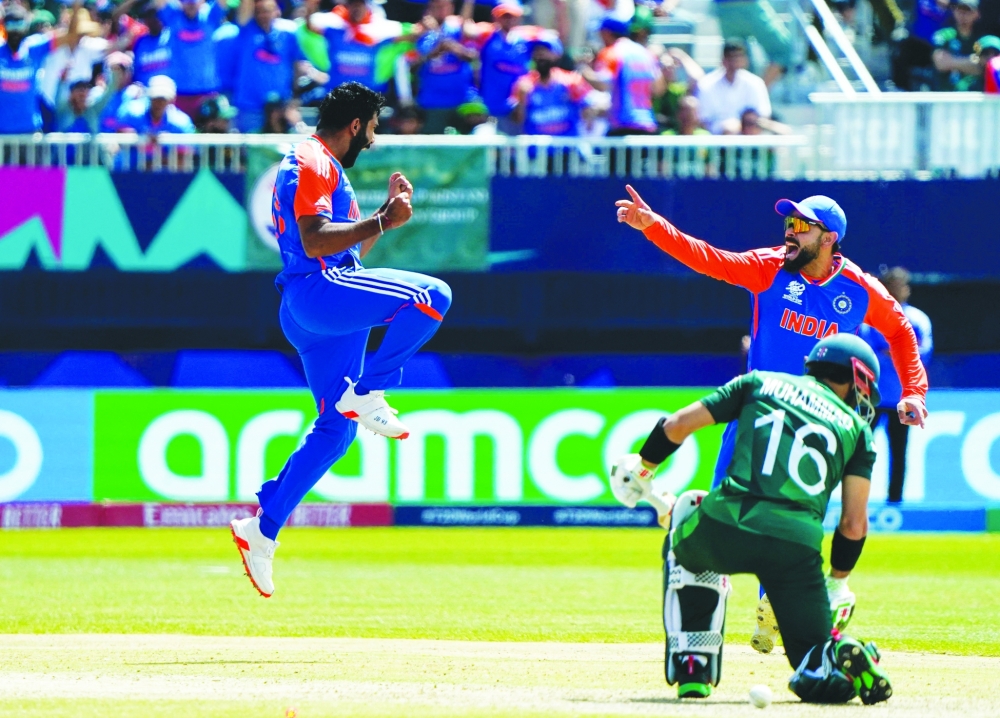 Jasprit Bumrah (L) celebrates after dismissing Pakistan's Rizwan.— AFP

