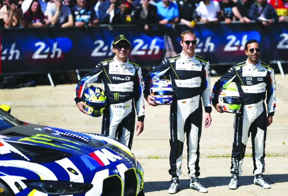 Ahmad al Harthy (right) with team-mates Maxime Martin and Valentino Rossi.