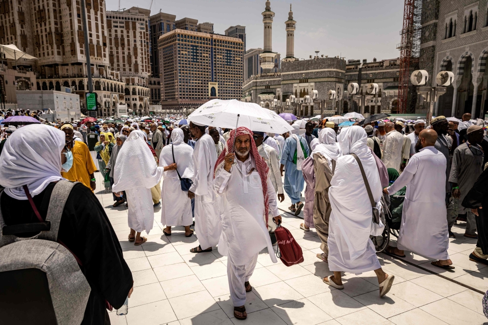 Pilgrims arrive to Saudi Arabia's holy city of Mecca ahead of the annual haj pilgrimage. — AFP 