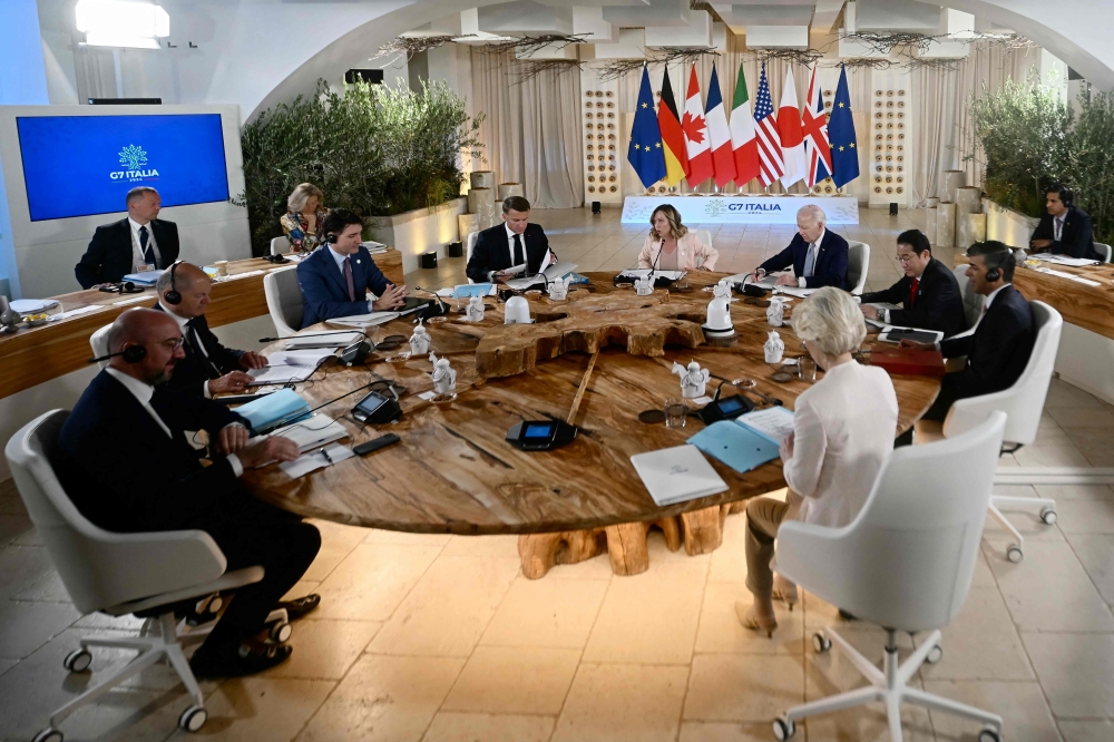 From left: President of the European Council Charles Michel, German Chancellor Olaf Scholz, Canadian Prime Minister Justin Trudeau, French President Emmanuel Macron, Italy's Prime Minister Giorgia Meloni, US President Joe Biden, Japanese Prime Minister Fumio Kishida, British Prime Minister Rishi Sunak, President, EU Ursula von der Leyen,  during the G7 Summit hosted by Italy in Savelletri. - AFP


