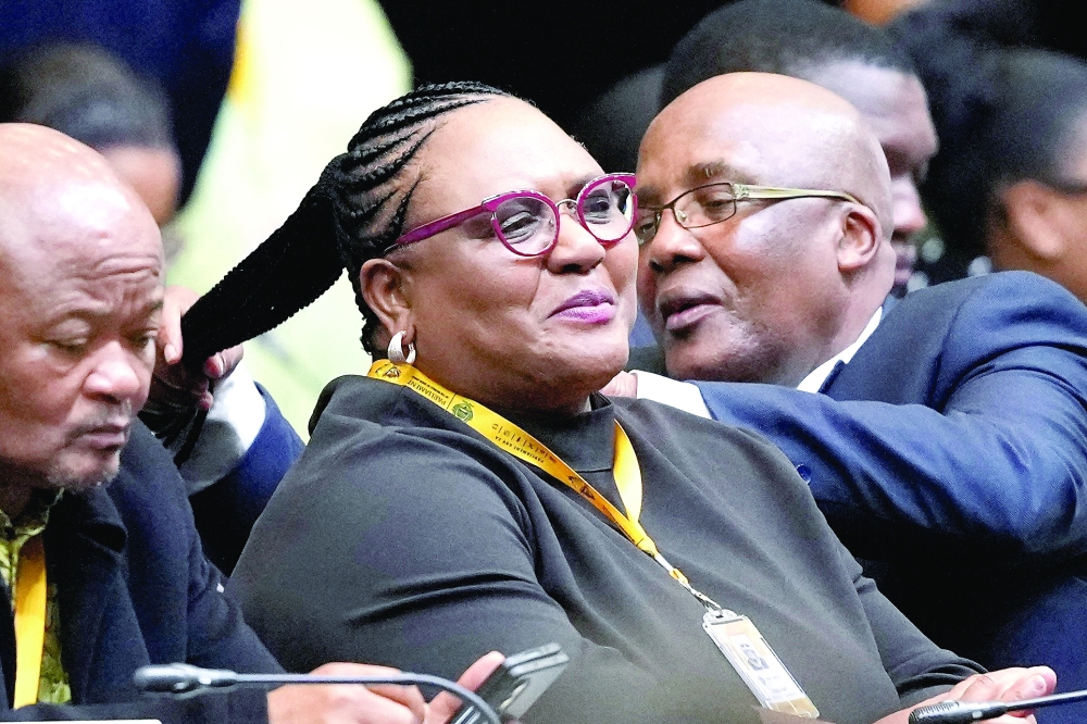 Newly elected Speaker of Parliament Thoko Didiza reacts during the first sitting of the National Assembly following elections in Cape Town