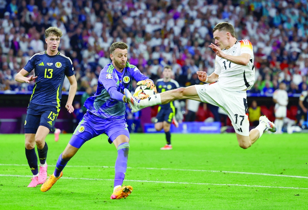 Scotland's Angus Gunn in action with Germany's Florian Wirtz -- REUTERS