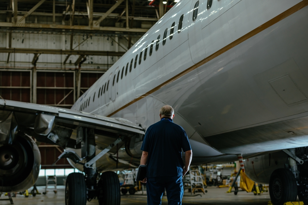 An inspector looks over a plane at O'Hare International Airport in Chicago, Sept. 11, 2020. (Lucy Hewett/The New York Times)