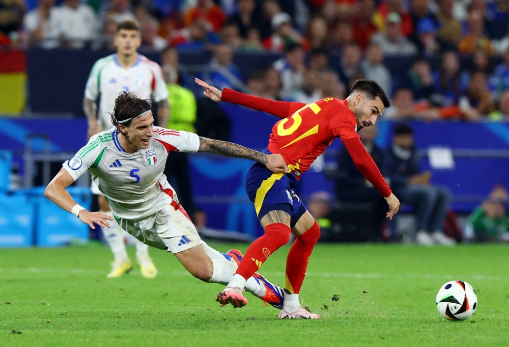 Italy's Riccardo Calafiori in action with Spain's Alex Baena -- REUTERS