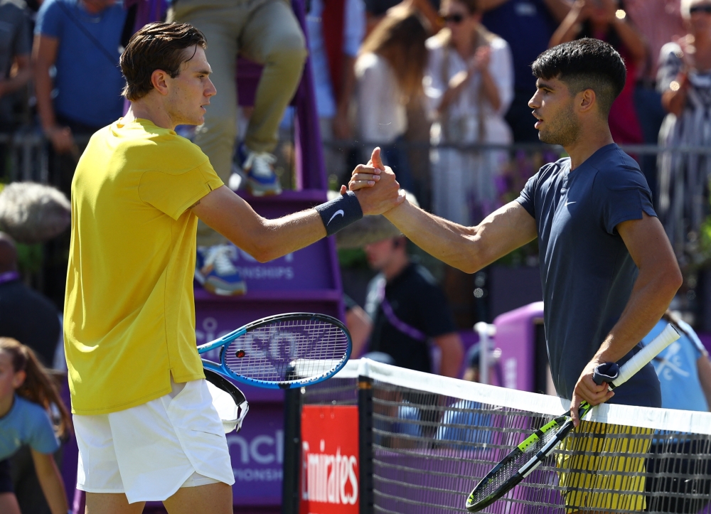 Britain's Jack Draper shakes hands with Spain's Carlos Alcaraz after winning his round of 16 match Action