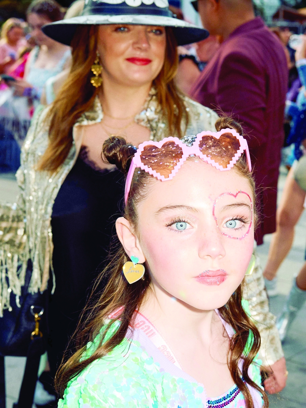 Fans arrive to attend the concert of US singer and songwriter Taylor Swift as part of her 'Eras Tour' at Wembley Stadium, west of London. - AFP
