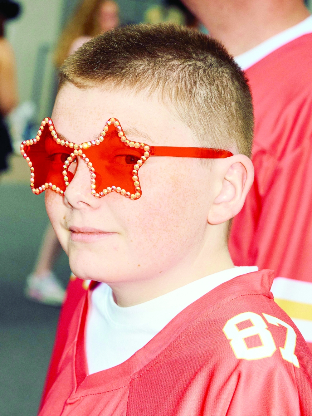 A fan poses with star sunglasses as Swifties arrive to attend the concert of US singer and songwriter Taylor Swift as part of her 'Eras Tour' at Wembley Stadium, west of London. - AFP
