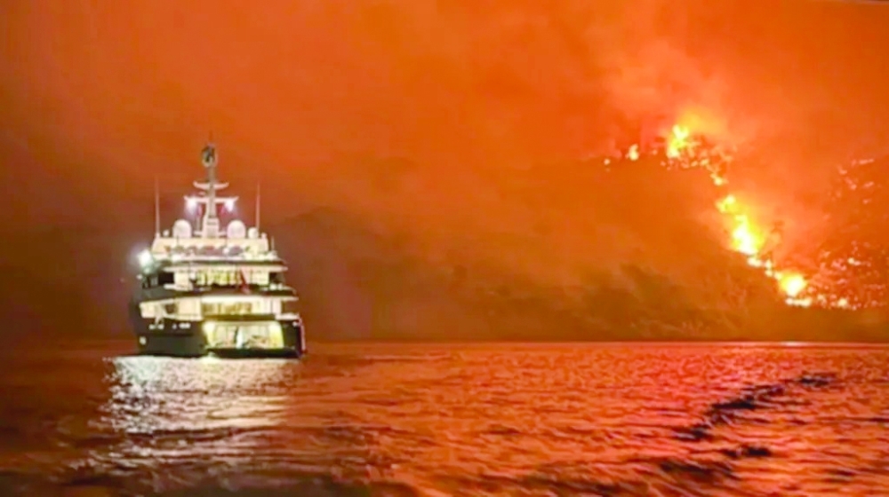 Fireworks on yacht set fire to forest on Greek island