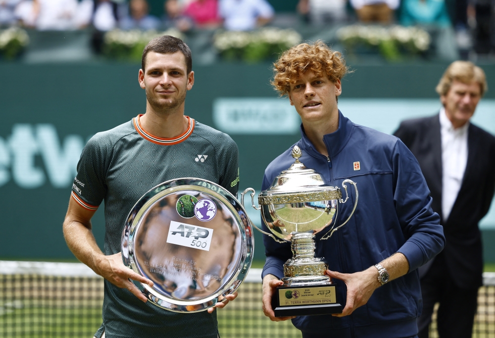 Sinner (R) pose with the trophy alongside Hurkacz. — REUTERS
