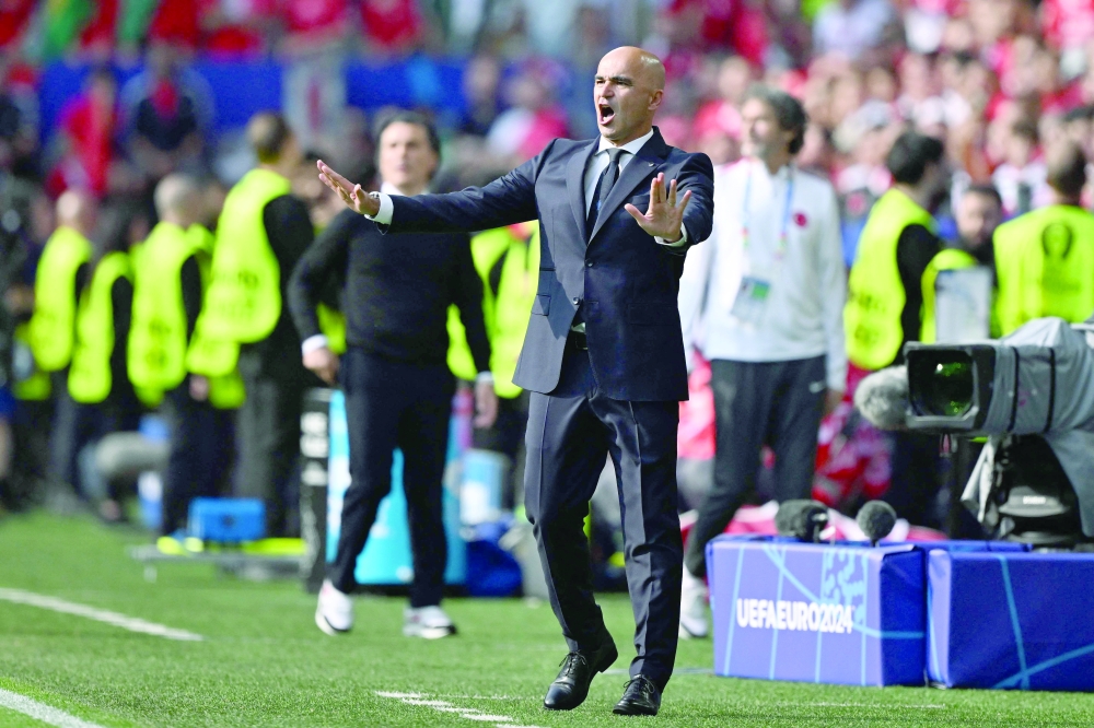 Portugal's head coach Roberto Martinez reacts during the Match. — AFP


