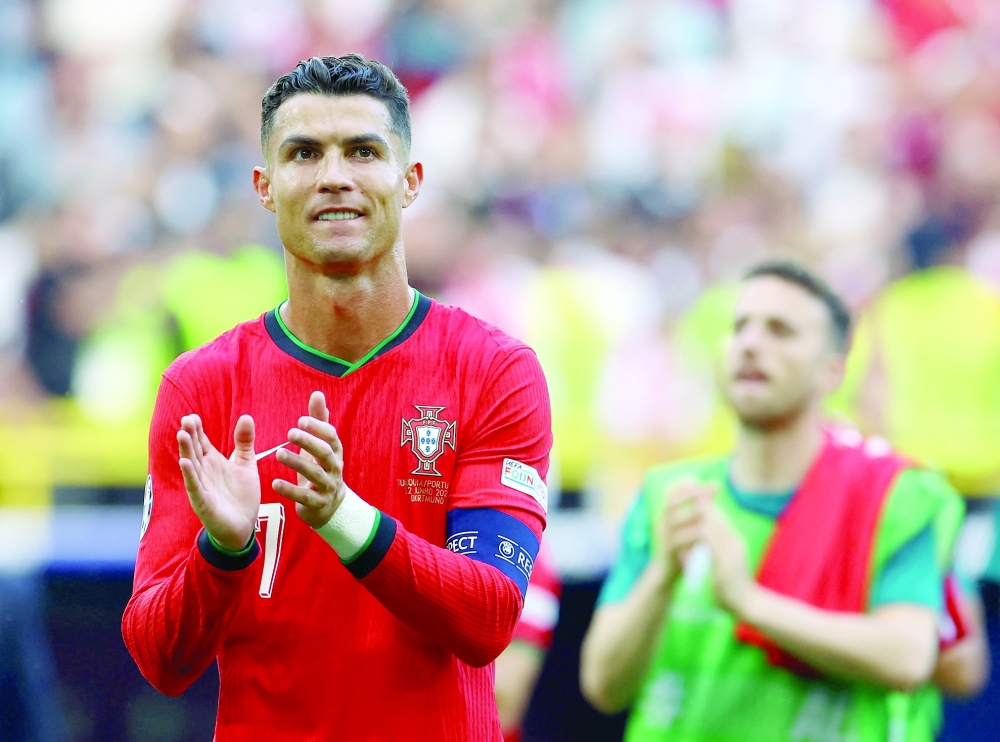 Cristiano Ronaldo applauds fans after the match.— REUTERS