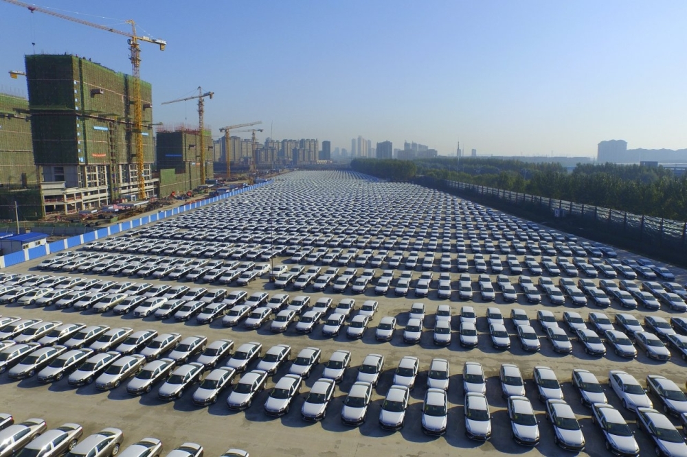 New Volkswagen cars sit in a parking lot in Changchun, Jilin province, China. — Reuters